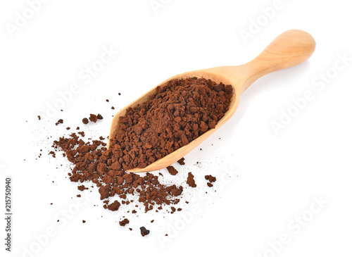 Coffee powder in spoon on white background