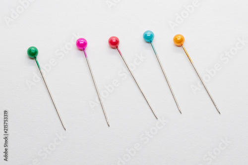 Isolated pin needles on white background © Alexander Oganezov