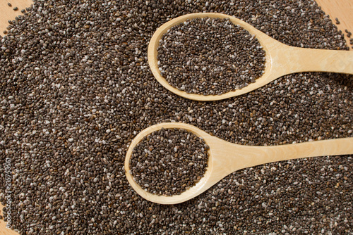 Healthy Chia seeds in a wooden spoon on a wooden table