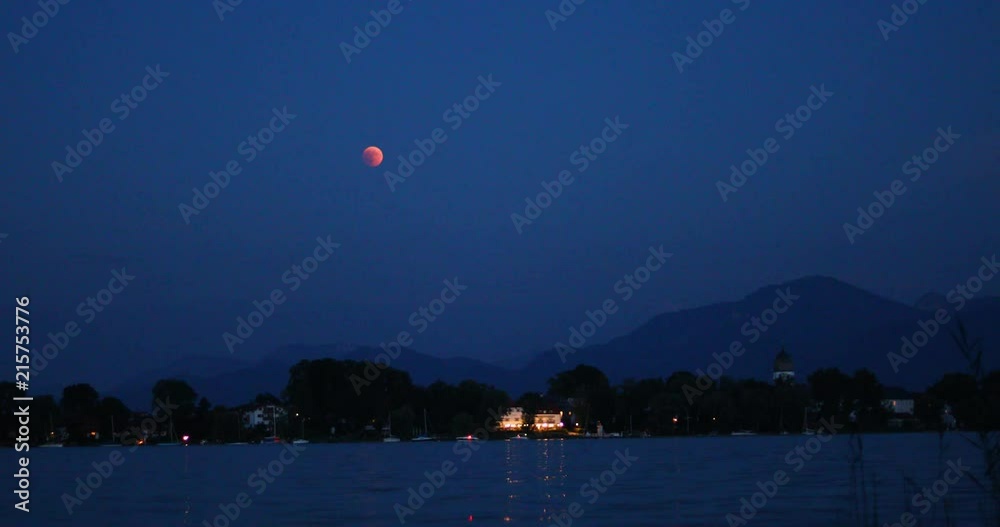red orange blood moon over island Fraueninsel on lake Chiemsee, Bavaria, Germany in 2018 red orange blood moon over island Fraueninsel on lake Chiemsee, Bavaria, Germany in 2018