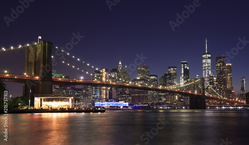 Panorama of Brooklyn Bridge and New York City  Lower Manhattan  with lights and reflections at dusk  USA