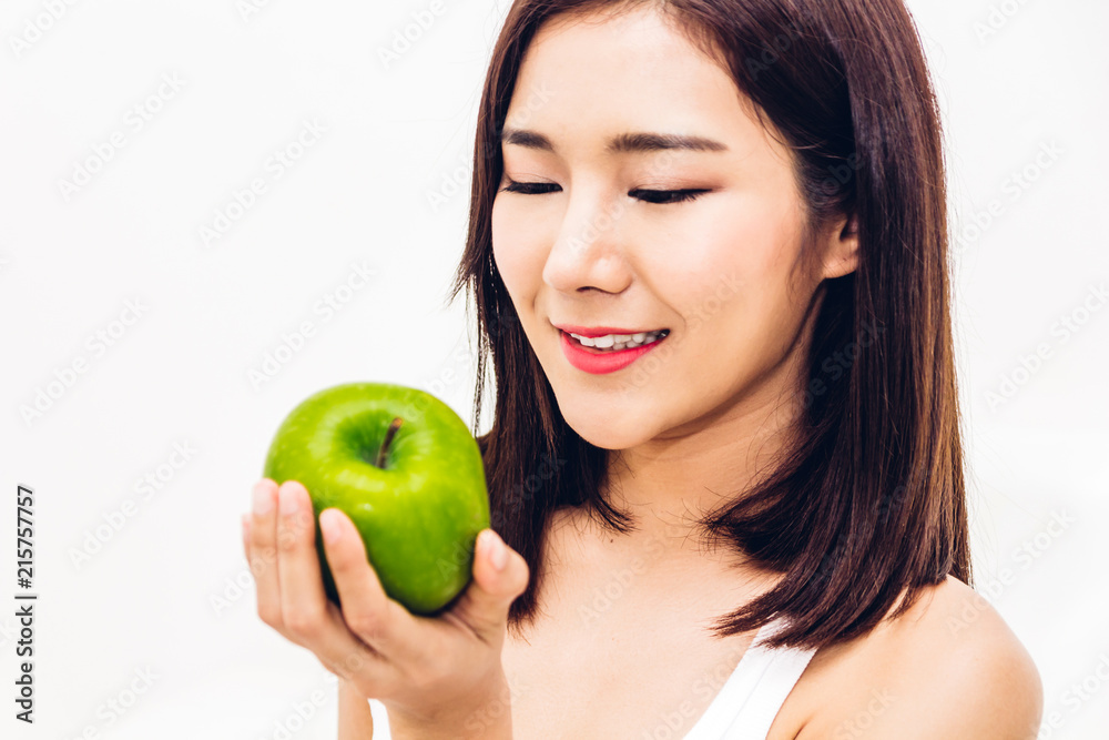 Woman holding and eating fresh green apple on white background.dieting concept.healthy lifestyle Woman holding and eating fresh green apple on white background.dieting concept.healthy lifestyle
