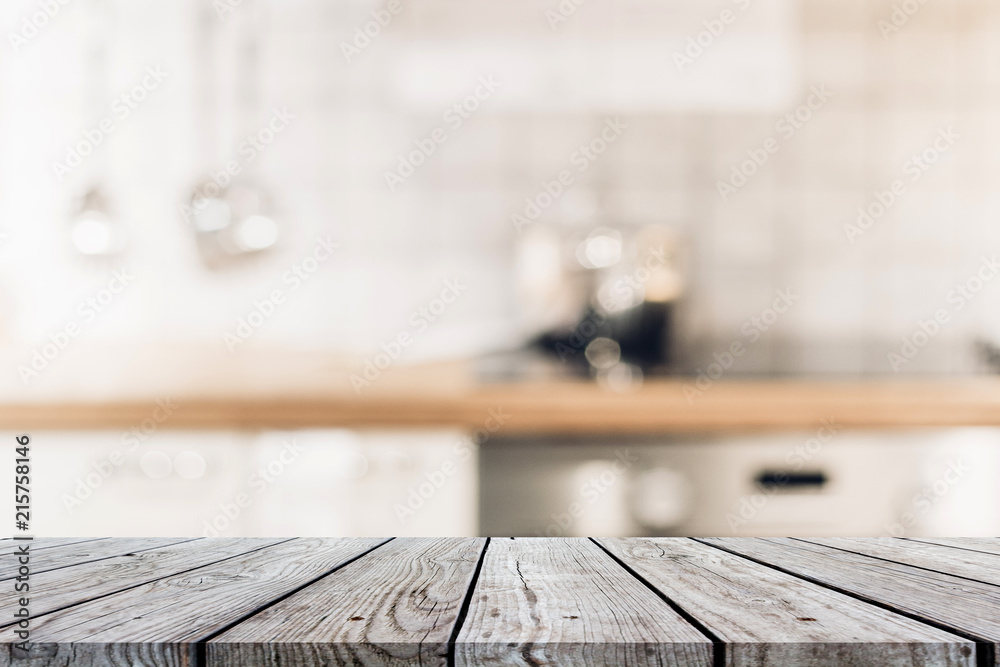 Wood table on blur Interior of kitchen background Wood table on blur Interior of kitchen background