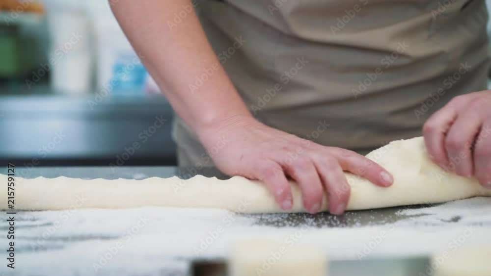 Making cookies, dough close-up of women's hands in the confectionery kitchen. Making cookies, dough close-up of women's hands in the confectionery kitchen.