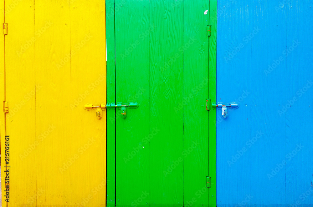 Tree wood doors in yellow green and blue