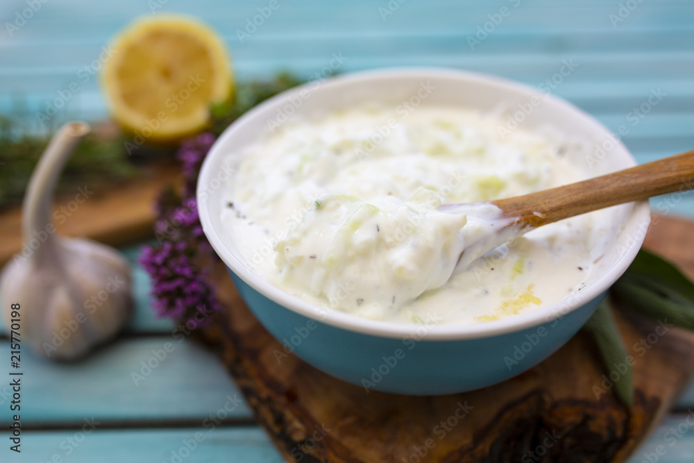 Traditional Greek tzatziki sauce and ingredients for the recipe.
Traditional Greek tzatziki sauce and ingredients for the recipe.