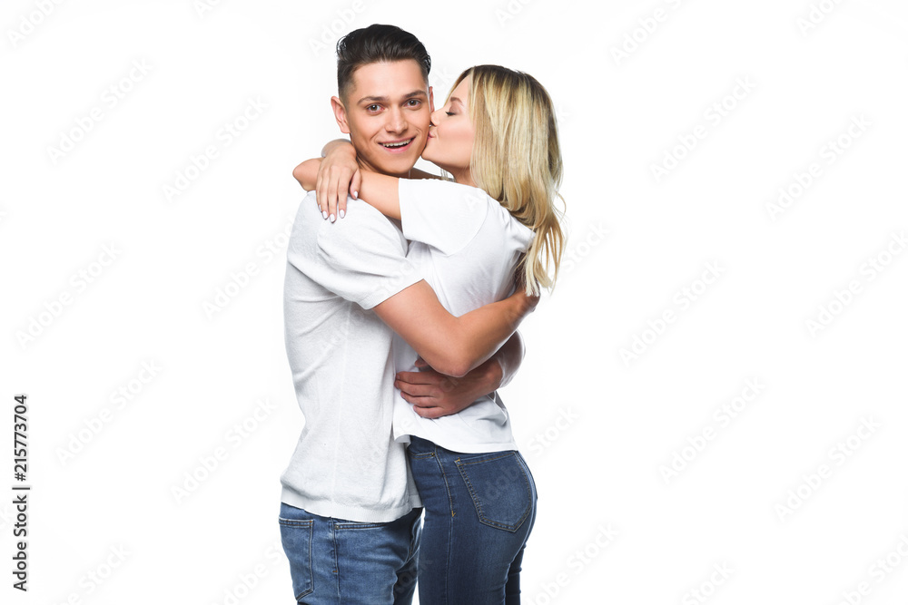 girlfriend hugging and kissing boyfriend isolated on white girlfriend hugging and kissing boyfriend isolated on white