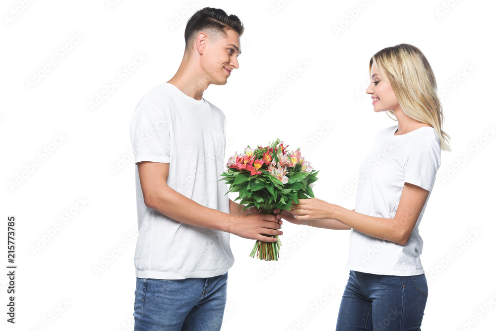 side view of boyfriend presenting bouquet to girlfriend isolated on white side view of boyfriend presenting bouquet to girlfriend isolated on white