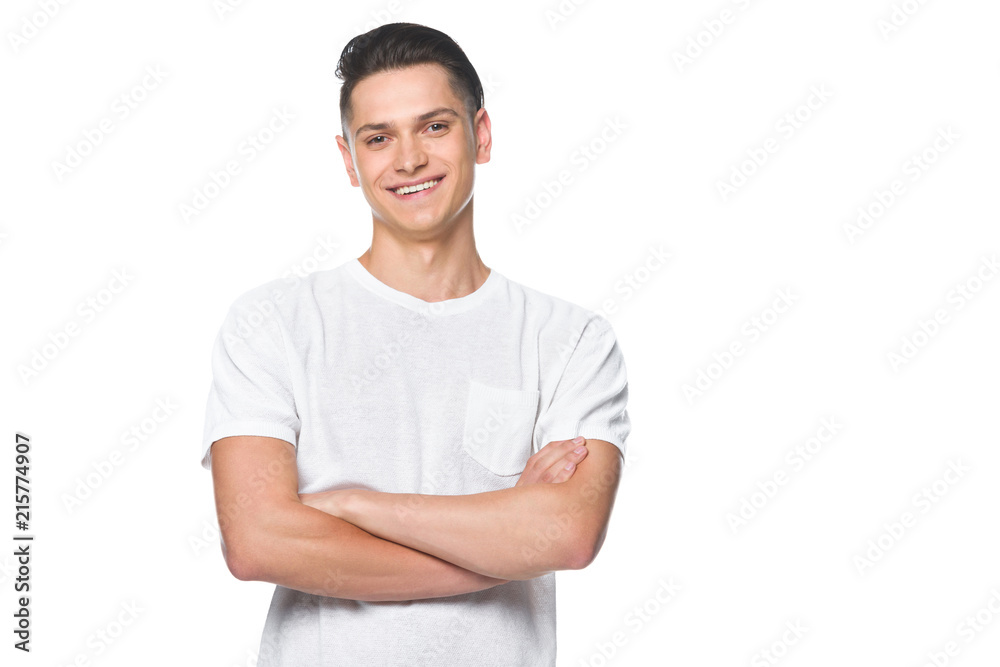 handsome smiling man standing with crossed arms in white shirt isolated on white handsome smiling man standing with crossed arms in white shirt isolated on white