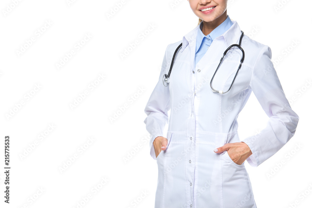 cropped view of smiling doctor posing in white coat with stethoscope, isolated on white cropped view of smiling doctor posing in white coat with stethoscope, isolated on white