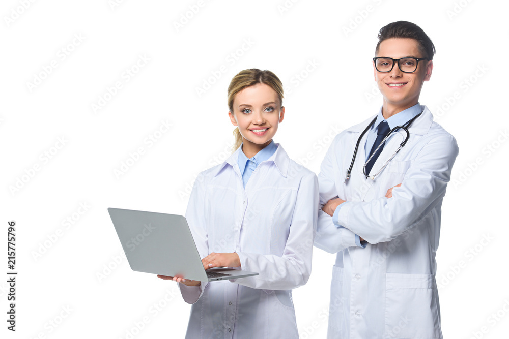 smiling general practitioners using laptop, isolated on white