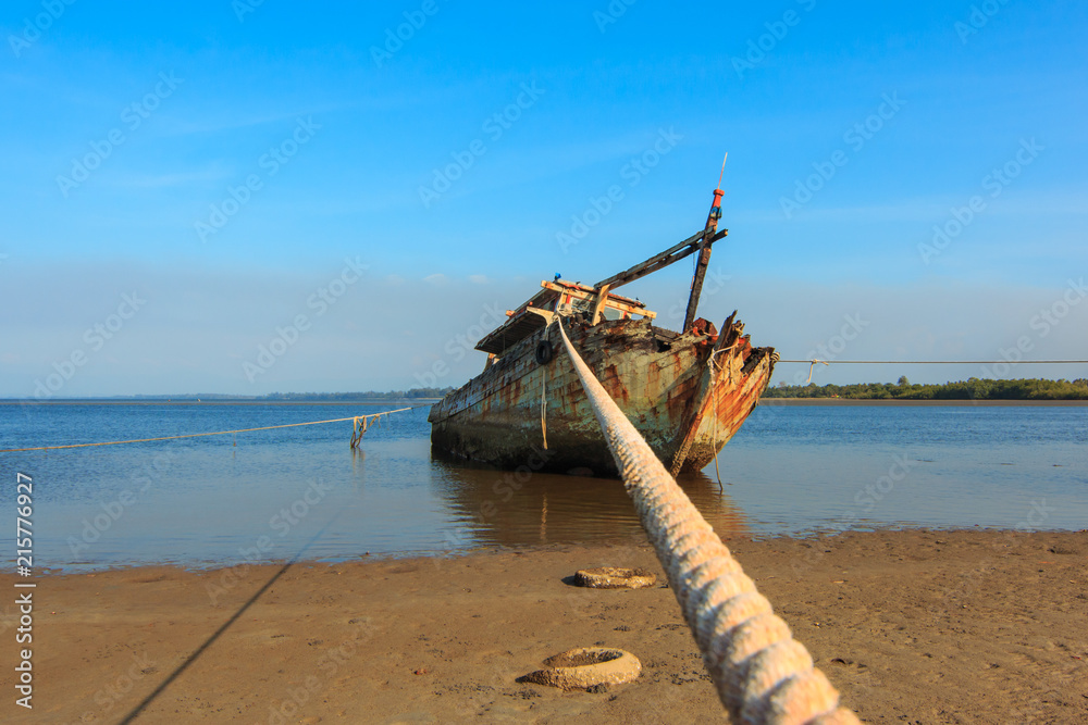 Broken and old fishing boat , Three Ship Wreck in Kuala Penyu, Sabah, Malaysia , Abandoned Ship at sabah borneo malaysia Image has grain or blurry or noise and soft focus when view at full resolution.