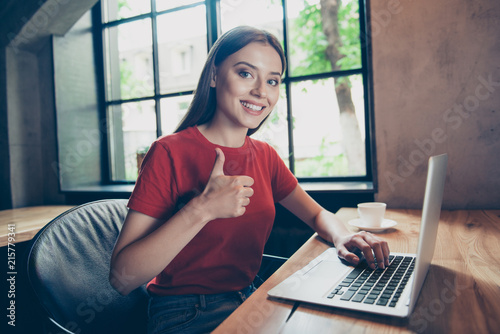 Photos Portrait of beautiful, attractive girl freelancer showing thumbs up working remo
