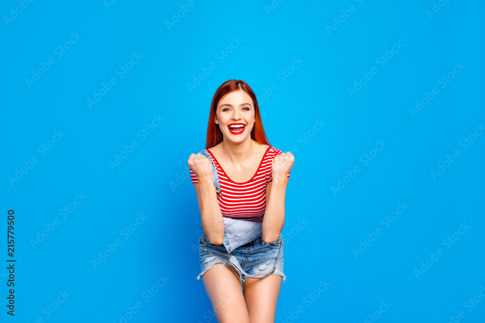 I like it so much! Close up studio photo portrait of crazy cheerful joyful rejoicing girl in striped t-shirt white skin gesturing with hands fists looking at camera isolated bright vivid background