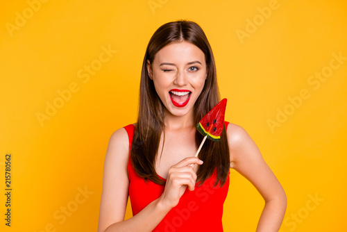 My diet is over! Close up photo portrait of beautiful excited cheerful pretty attractive nice glad lady holding sweet on stick in hand isolated on vivid bright background