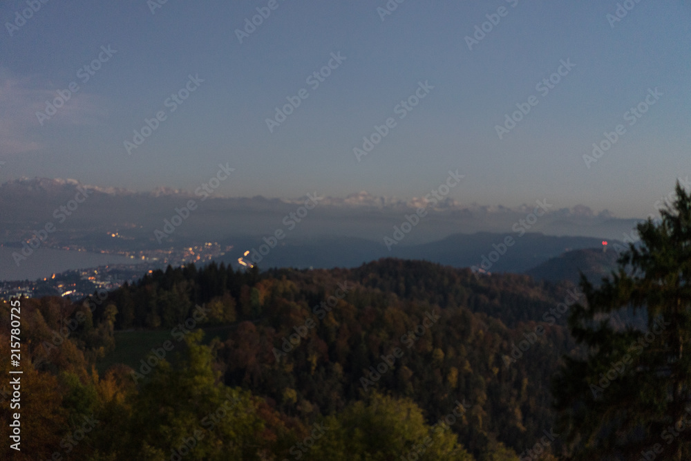 zurich city panorama at sunset seen from uetliberg mountain