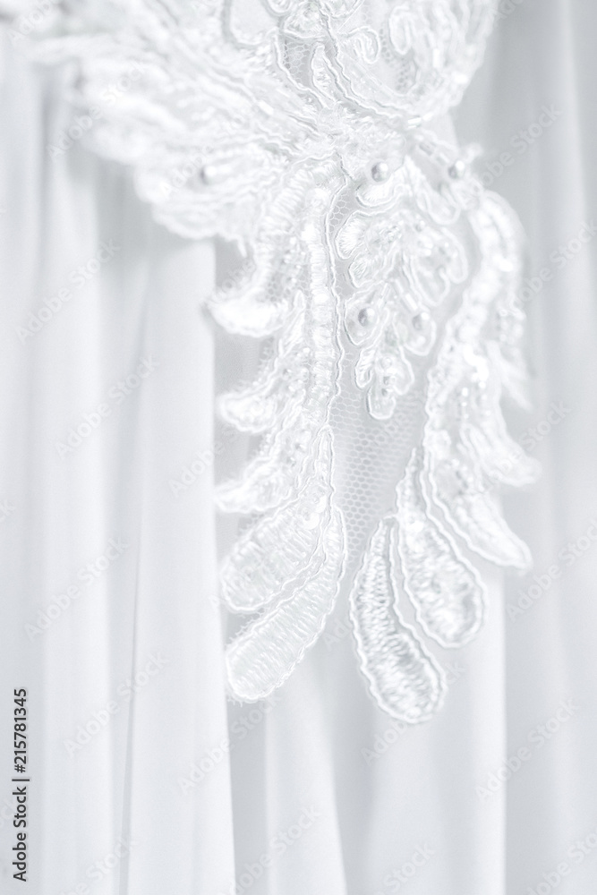 Lace embroidery on a wedding dress closeup