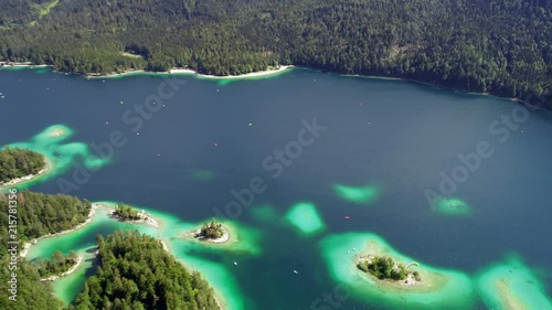 4K scenic flight of Eibsee in Bavaria on the bottom of Zugspitze the highest mountain in germany