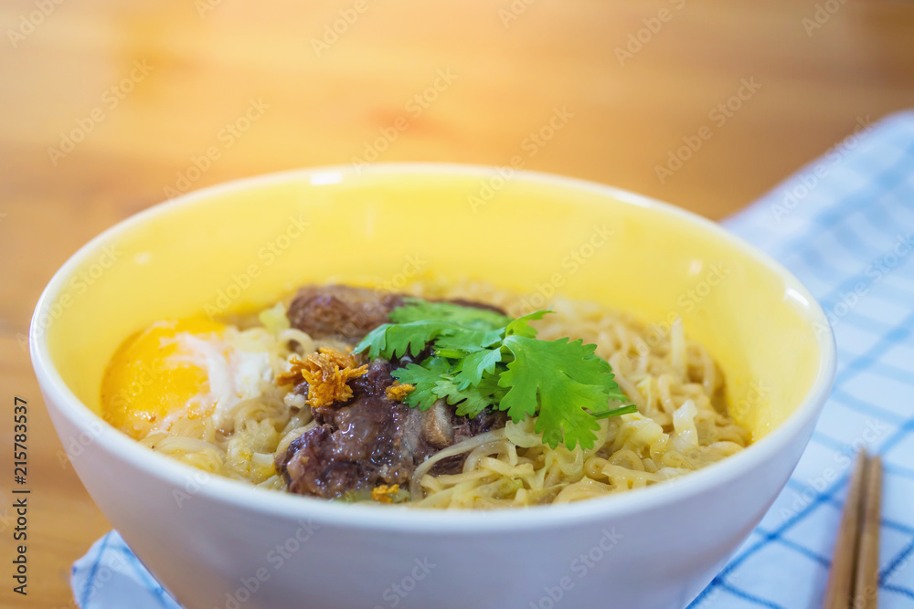 Instant noodle with pork and egg ready to be eaten - delicious instant food menu concept