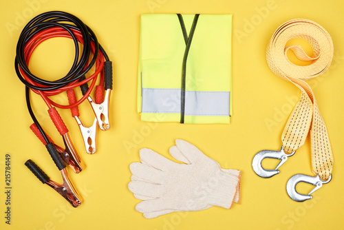 flat lay with arrangement of automotive accessories isolated on yellow