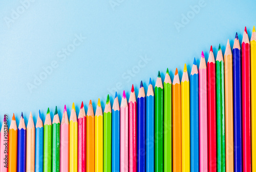 Education or back to school Concept. Close up macro shot of color pencil pile pencil nibs on blue background.