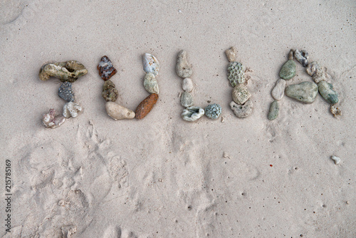 Julia name made by corals on the beach photo