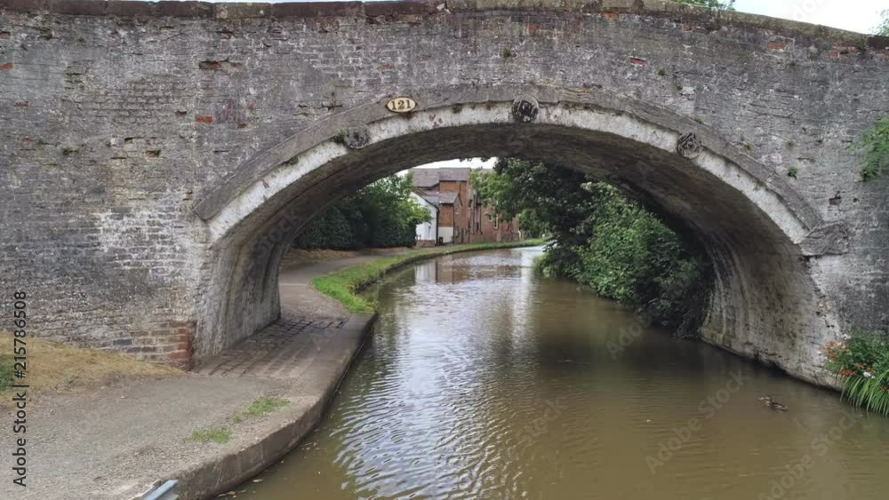 Move forward under canal bridge, behind tree reveals brick house with interesting overhang. Move forward under canal bridge, behind tree reveals brick house with interesting overhang.