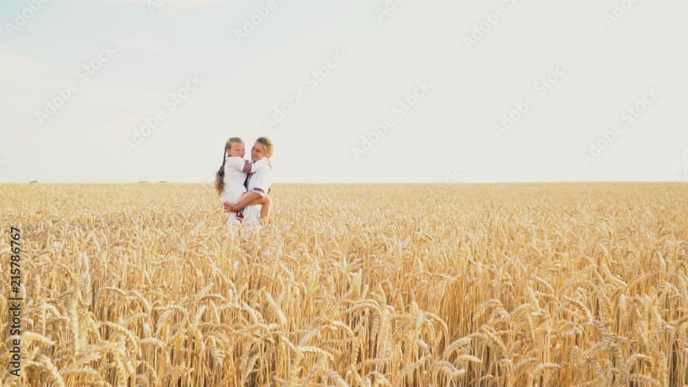 Mom and baby are going through a wheat Mom and baby are going through a wheat