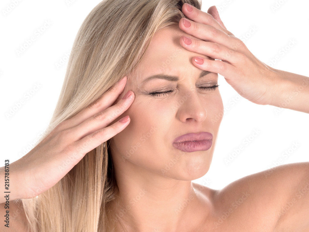 Headache concept - young woman suffering a migraine. Headache concept - young woman suffering a migraine.
