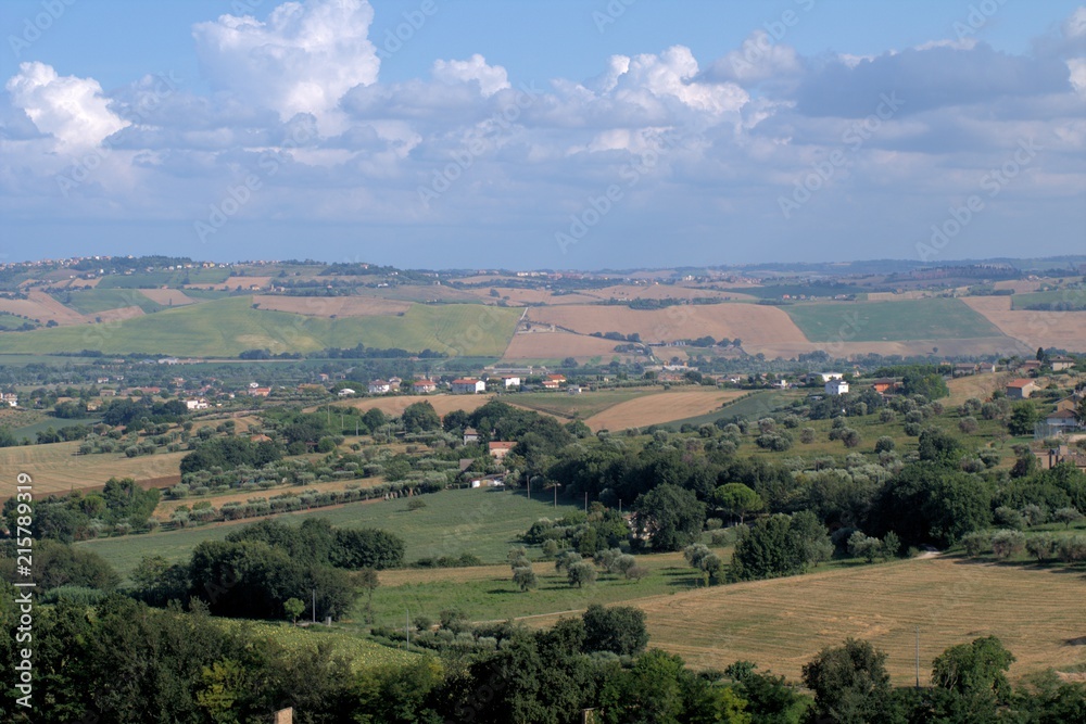 landscape,hills,countryside,panorama,clouds,horizon,sky,cumulus,view,crops,field,panoromic,summer,Italy,rural