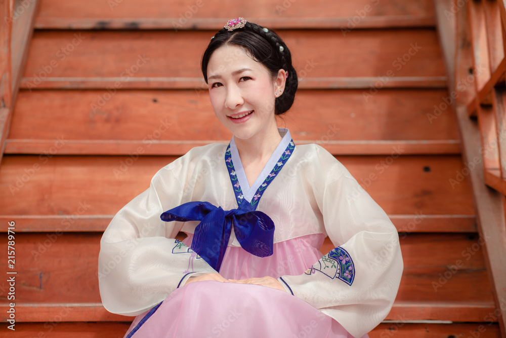 Woman wearing Hanbok, Korean traditional dress costume walk and travel in Seoul city, South Korea Woman wearing Hanbok, Korean traditional dress costume walk and travel in Seoul city, South Korea