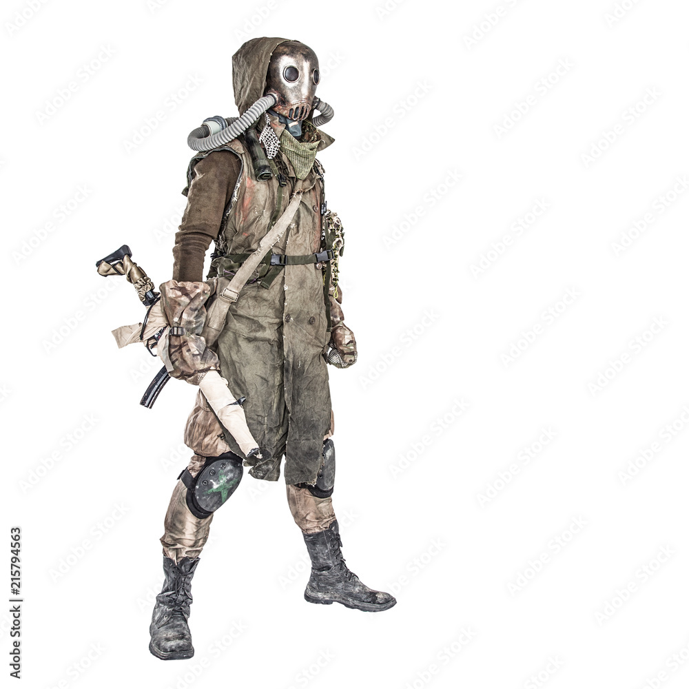 Survivor inhabitant of contaminated by nuclear catastrophe or dangerous chemical pollution world, in tatters and gas mask, standing with handmade firearm gun, isolated on white background studio shoot Survivor inhabitant of contaminated by nuclear catastrophe or dangerous chemical pollution world, in tatters and gas mask, standing with handmade firearm gun, isolated on white background studio shoot