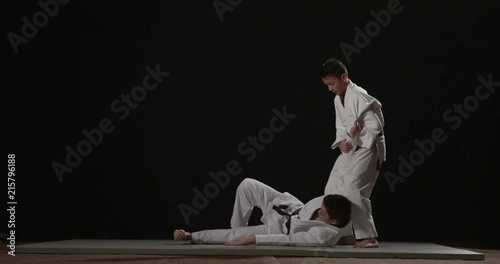 Judo throw technique on black background