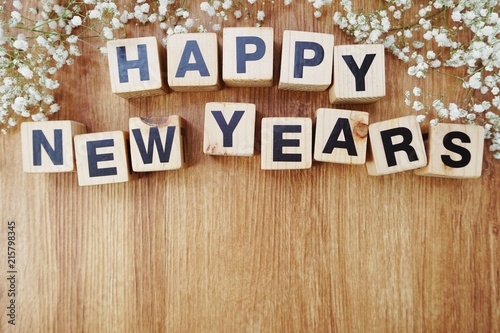 happy new years alphabet letters on wooden background