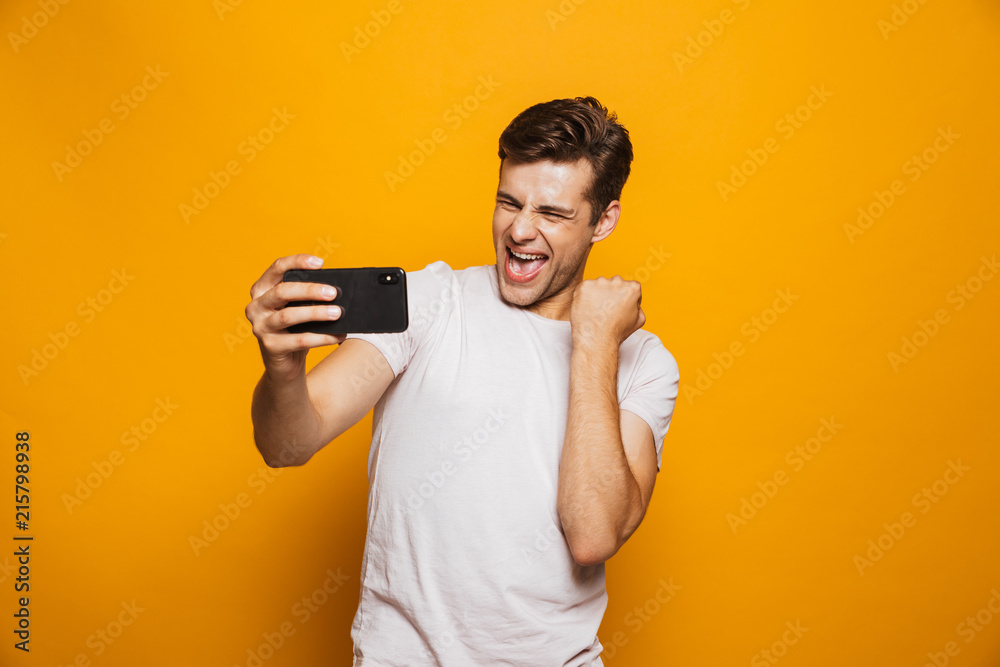 Portrait of a happy young man taking a selfie Portrait of a happy young man taking a selfie