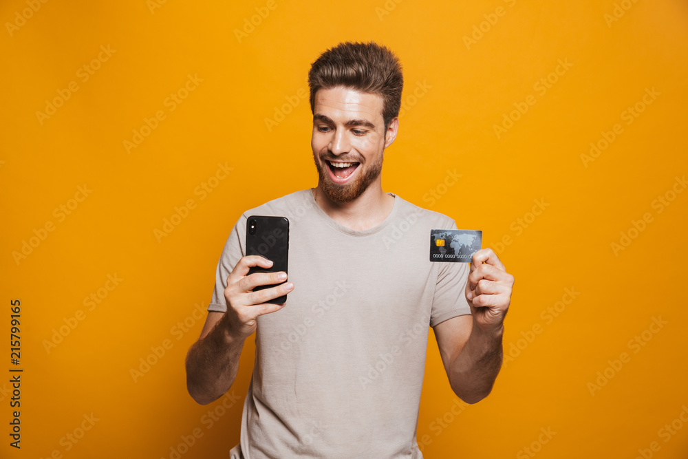 Portrait of a happy young man using mobile phone Portrait of a happy young man using mobile phone