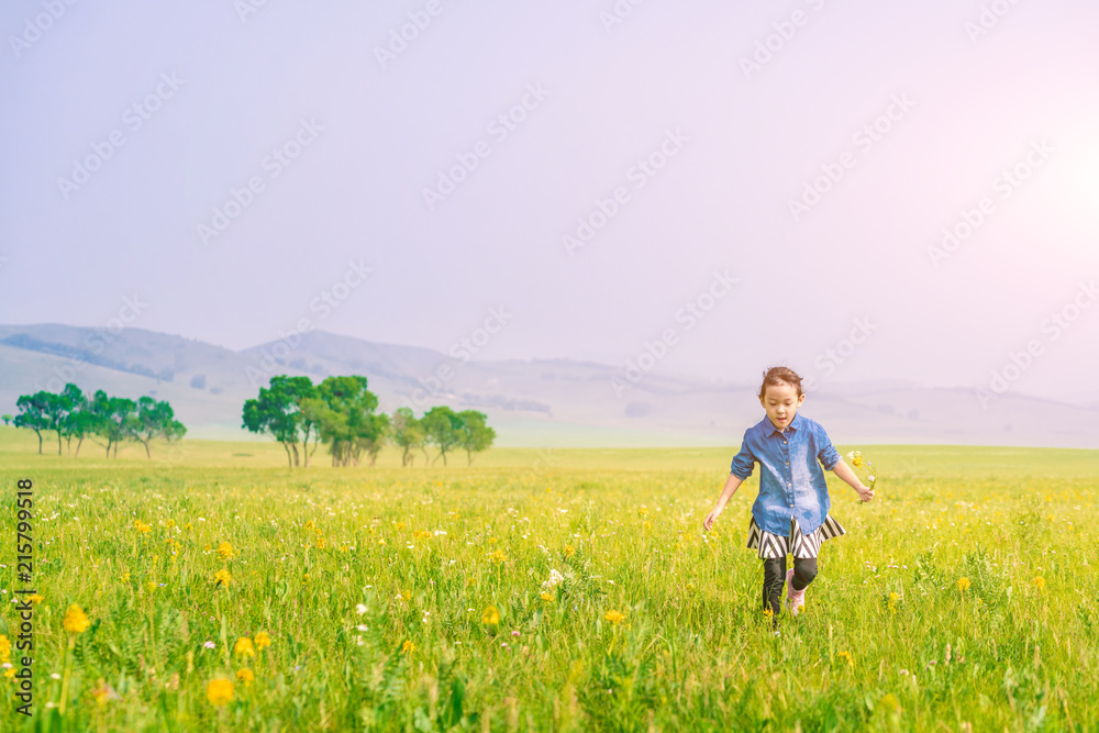 A girl playing on the prairie