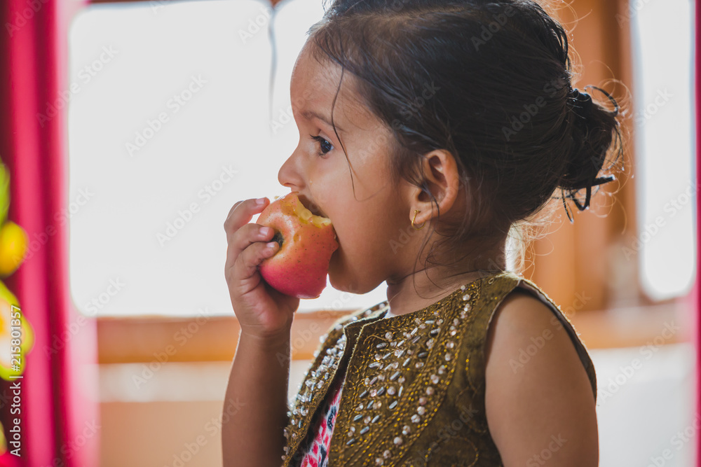 Cute Happy Child Eating Red Apple Cute Happy Child Eating Red Apple