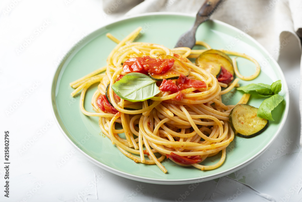 Traditional itaian spaghetti with tomato and zucchini