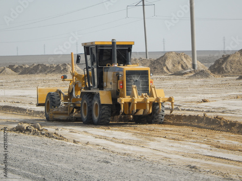 Road scraper in the steppe.