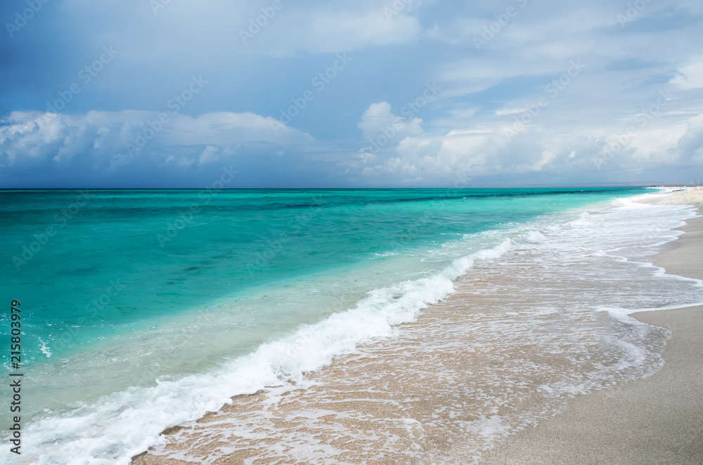 Beautiful seascape, turquoise sea and blue clouds before a thunderstorm.