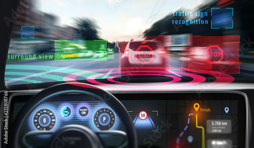 Robotic hands on steering wheel while driving autonomous car. 3D illustration.