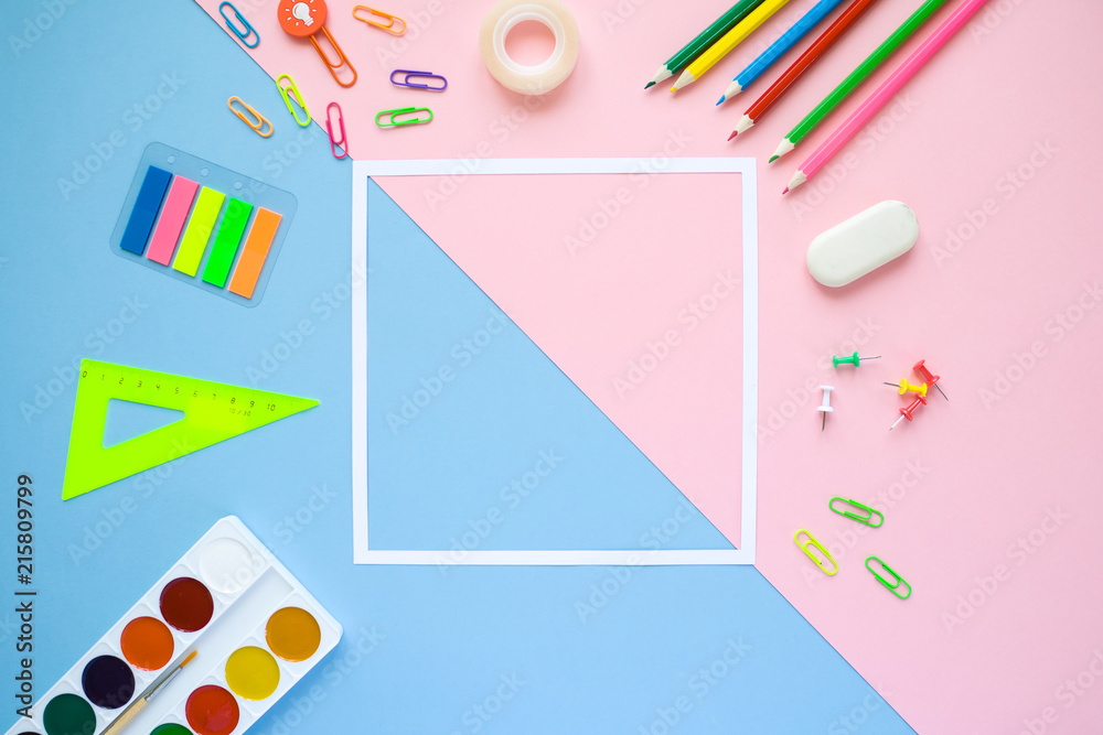 stationery flat lay on pink and blue background
