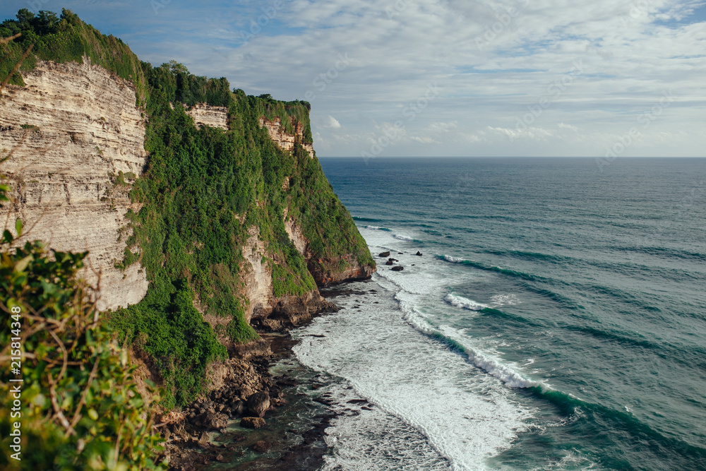 Amazing view of steep cliff and ocean view from Uluwatu temple in Bali island.The cliff-fringed coastline overlooking the Indian ocean.