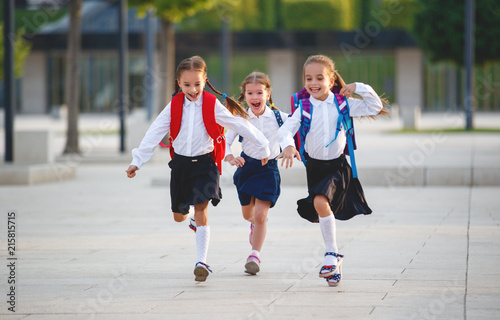 Foto Happy children  girlfriend schoolgirl student elementary school
