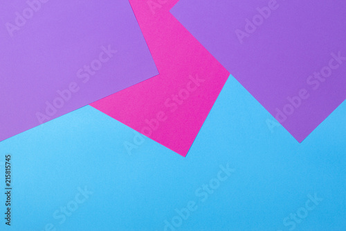 Color papers geometry flat composition background with pink violet and blue tones