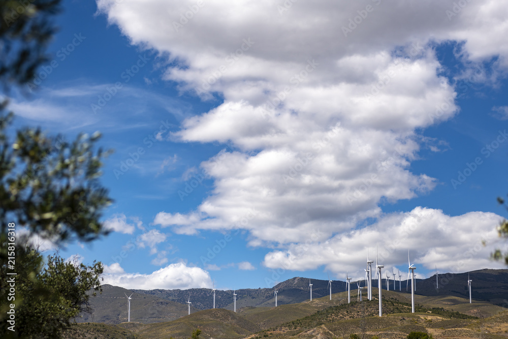 wind generators, always working, clean energy that contrasts with the landscape...