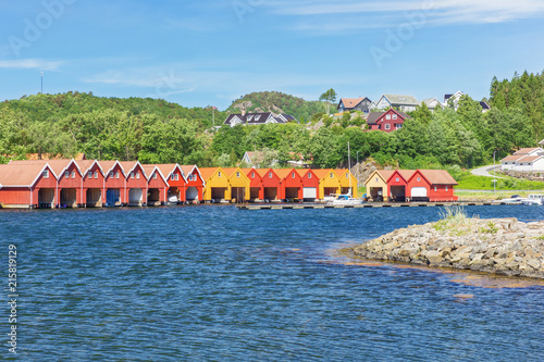 Typical Norwegian boat houses at the waterfront in Svennevik