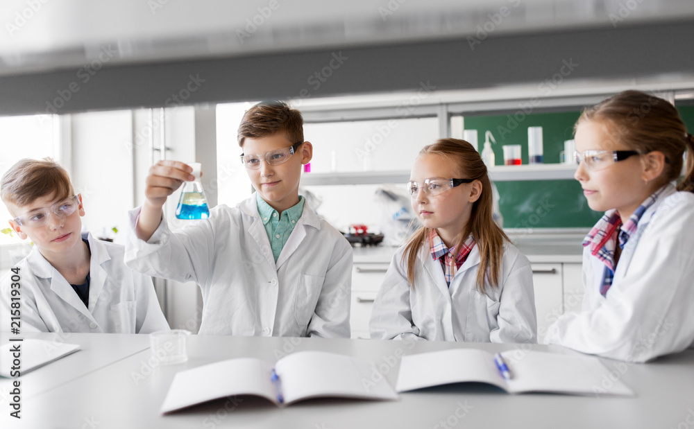 education, science and children concept - kids with test tubes studying chemistry at school laboratory education, science and children concept - kids with test tubes studying chemistry at school laboratory