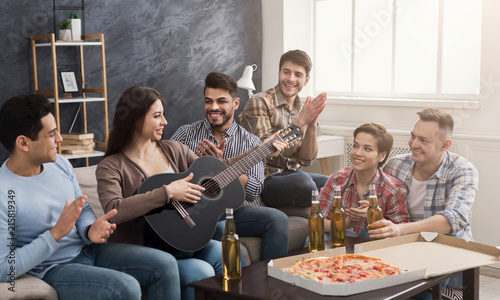 Multiracial friends having fun at home photo